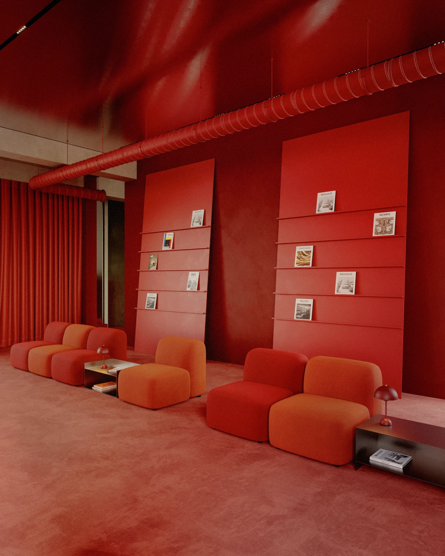 Monochromatic red lounge interior with modular red-orange sofas, red carpet and walls, tall display panels holding magazines, and an exposed red ceiling duct